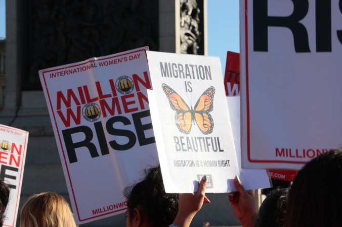 Although violence against women is a more focussed topic than climate change, other issues were still brought in by demonstrators, such as this sign about migration. 