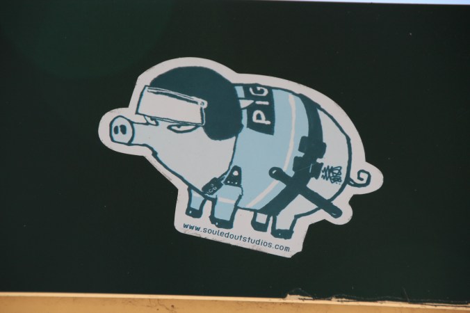 This sticker is decidedly anti-police, playing rather unsubtly on the fact that police are often called 'pigs'.