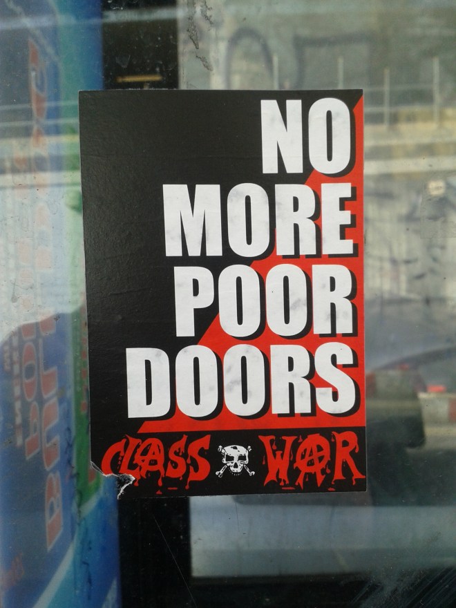 Over the past few months, it has come to light that some property developers build separate entrances for the social housing in their developments.  This sticker is calling for an end to these 'poor doors'.
