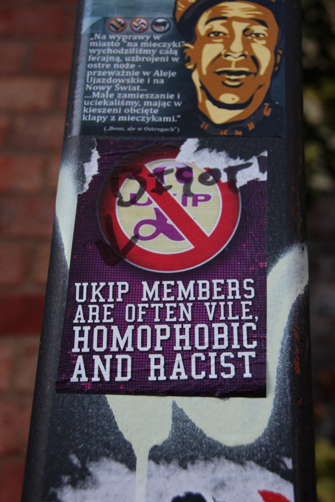 This sticker is another criticism of UKIP, but it has been grafittied, accusing the person who made the sticker of bigotry (Regent's Canal tow path, Camden, 20/05/15).