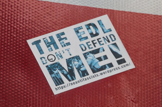 Anti-fascists often campaign on specific issues that they consider related to fascism. This sticker is playing on the name of the English Defence League. 