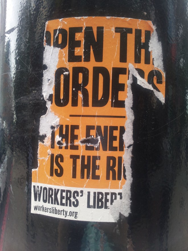 Some stickers get weathered or torn, so that their message is obscured. This sticker, made by Worker's Liberty says 