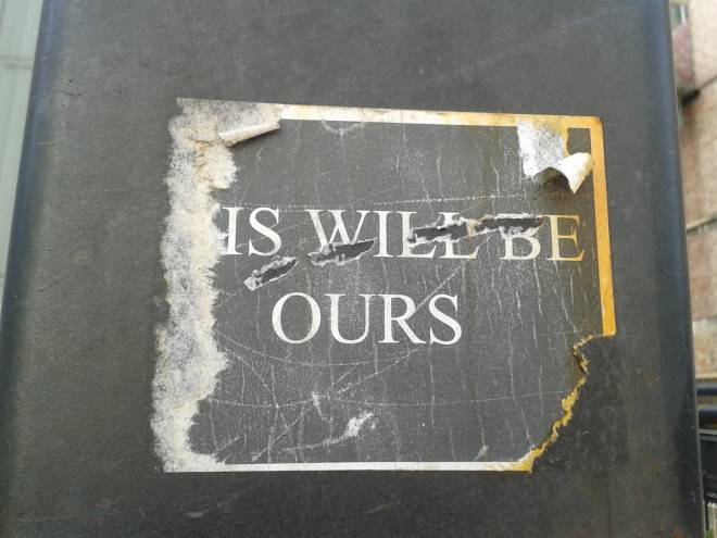 Although scratched and torn, it is easy to make out the intent of this sticker. The message- 
