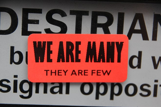 This empowering sticker is a reminder that the government only governs because we allow it to. If everyone decided to act together, it would create a very powerful force (Photo: Hannah Awcock. 20/06/15 Fleet Street).